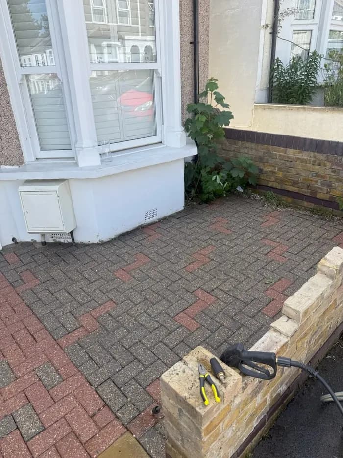 Same side patio area fully restored and weed-free after pressure washing